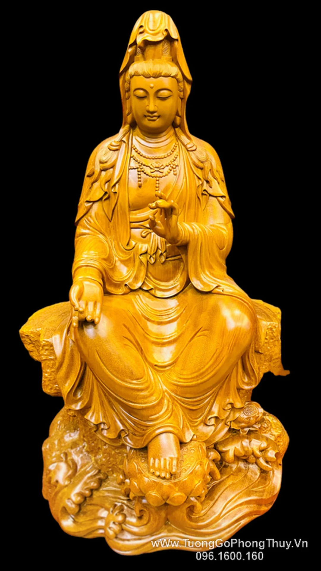 tượng quan âm tự tại tĩnh tọa trên đá cho không gian thiền