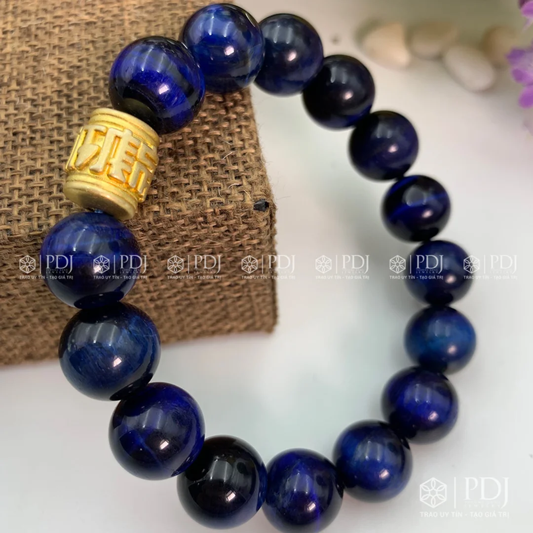 vòng đá mắt hổ xanh dương charm trụ chữ bình an