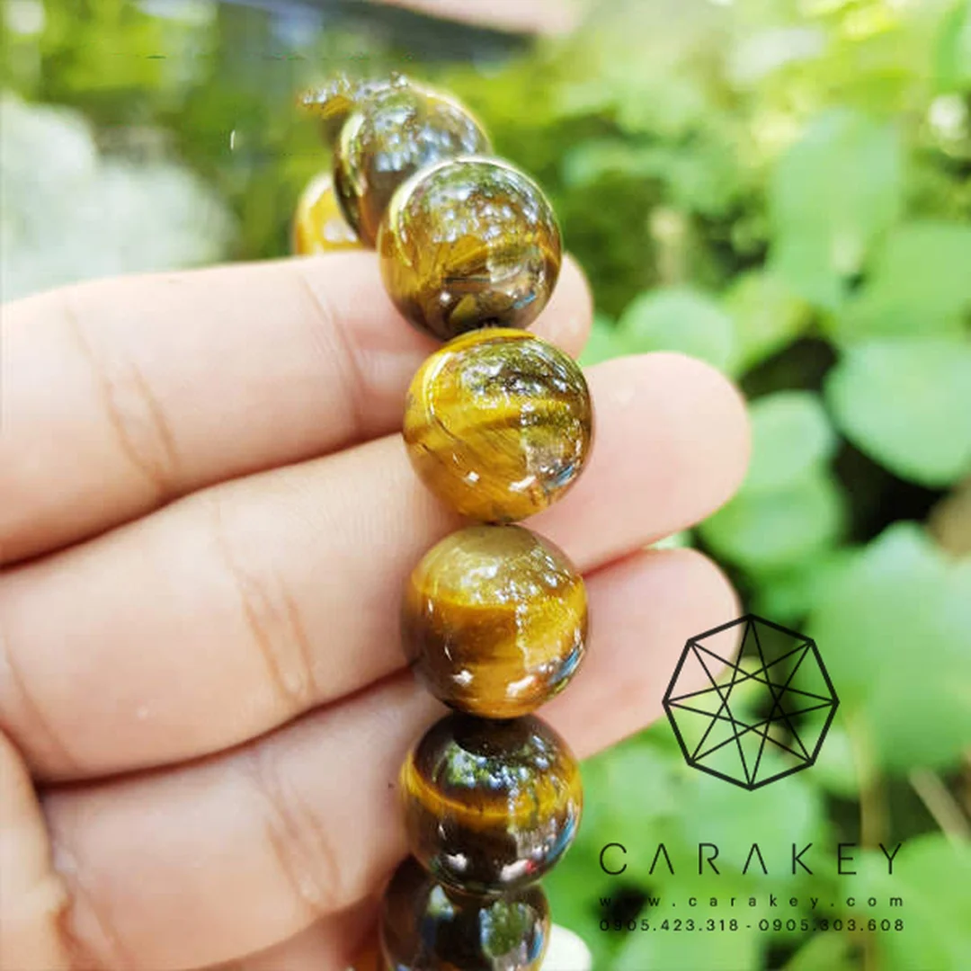 vòng tay đá mắt hổ vàng nâu phối charm rồng bạc